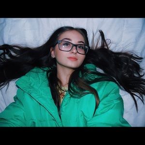 green/turquoise puffer jacket